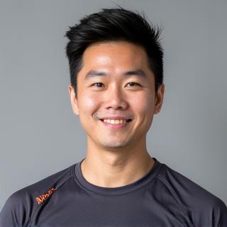 Professional headshot of Coach Kim Min-jun, a male in professional fitness attire.
